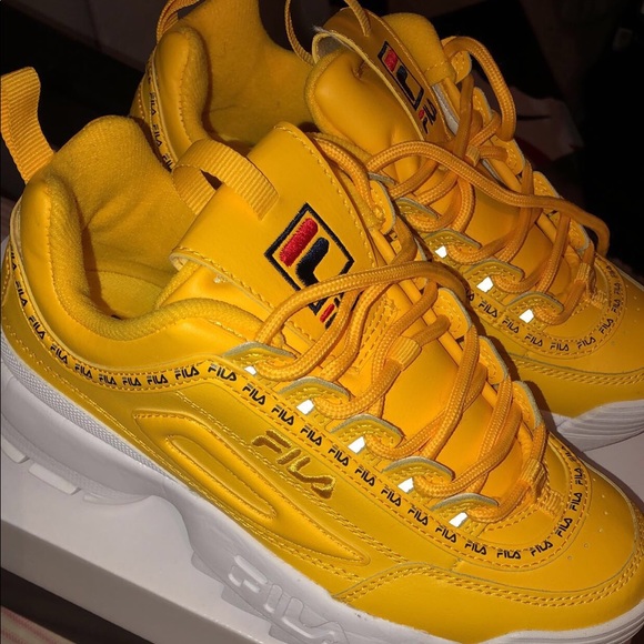yellow and white fila shoes